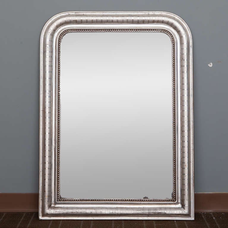 Circa 1860s silver gilt finish Louis Philippe mirror with beaded inner edge.  Other various size silver leaf finish mirrors in this style available - please inquire.