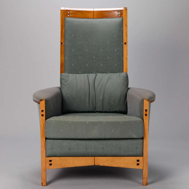 Circa 1970s midcentury high back armchair and ottoman in the Art Nouveau style of Charles Rennie Mackintosh. Light colored wood frame is in excellent condition; original light teal fabric is faded. Dimensions shown are for the chair only. Chair arms
