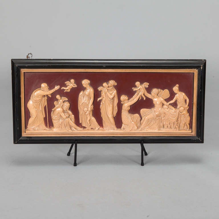 This circa 1960s Danish terra cotta plaque has a black frame and beautifully rendered neoclassical style figures in contrasting color and relief.  