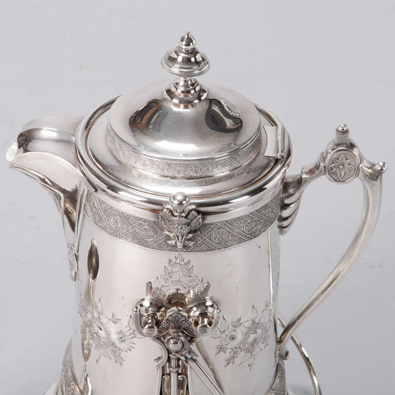 Circa 1883 large Reed and Barton engraved silver plated water jug on stand and goblet. Custom presentation engraving reads:  Presented to Rev. W.S. Heywood by Unity Club April 6 1883  Holyoke, Mass.  Jug has enamel liner and stand that allows jug to