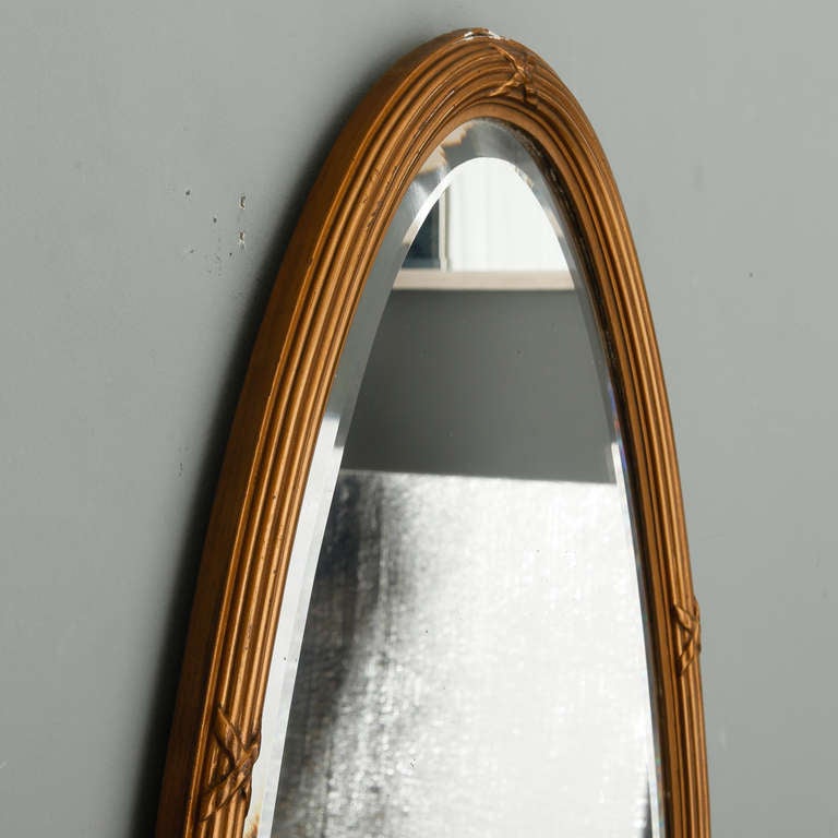 narrow oval mirror