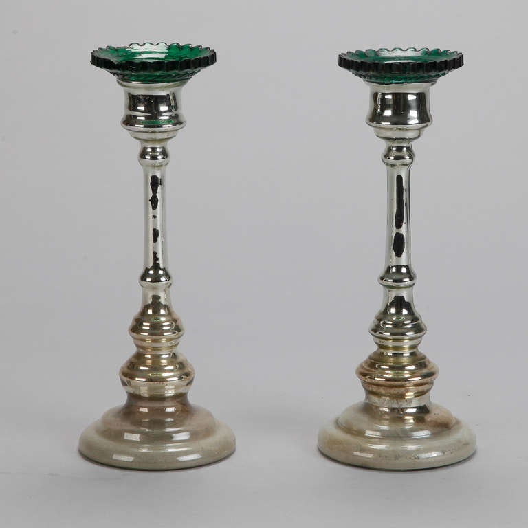 Circa 1900 pair of English mercury glass tall candlesticks with wide pedestal bases and contrasting emerald green glass bobeches.