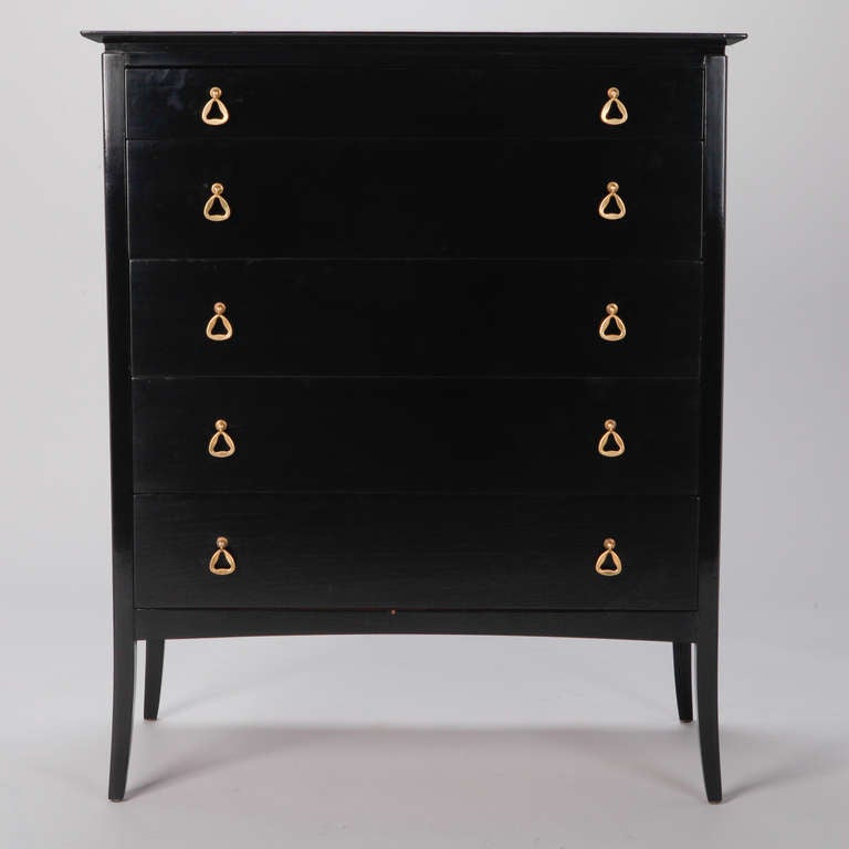 Circa 1960s chest of drawers with glazed ebonised finish and brushed brass drawer pulls.