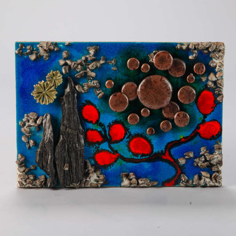 Large German ceramic plaque depicts abstract garden scene with applied details. Vibrant shades of blue and red with earth tones. Signed Gerharz 1974 on back.