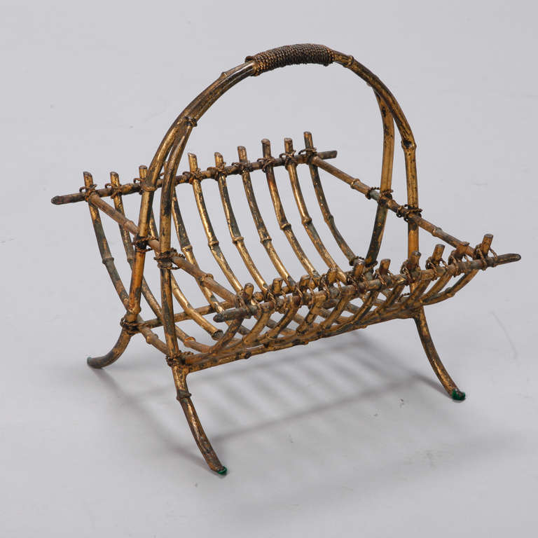 Circa 1930s faux branch style iron basket with bronzed finish and tall, curved handle.