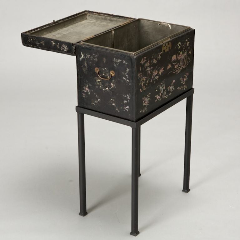 This 19th century black wooden Chinese box has a functional lock, and an elaborate scene rendered in mother-of-pearl inlay. Sits on a custom made metal stand and can function as a small side or end table.