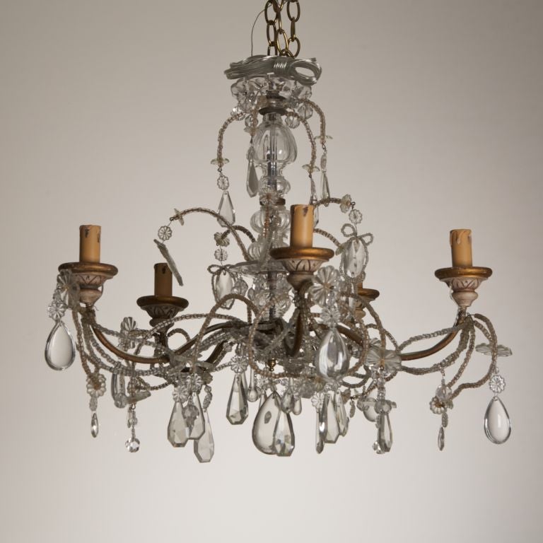 This French five-light metal frame chandelier with beads, crystal drops and faceted crystal beads.