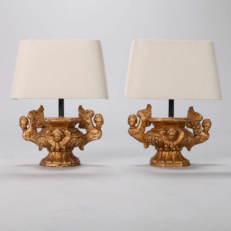 Pair of 19th century Italian carved and gilded wood balustrades with angels form the base of these table lamps. New wiring for US electrical standards.