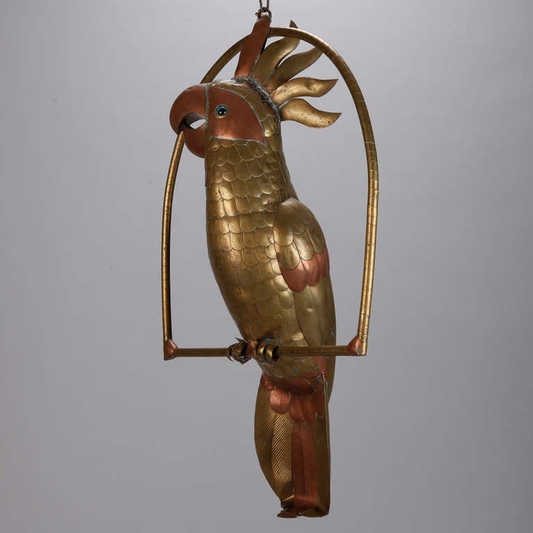 Made in the 1960s by someone at the Amsterdam School of Art, this large, whimsical cockatoo on a perch is sculpted from copper and brass.