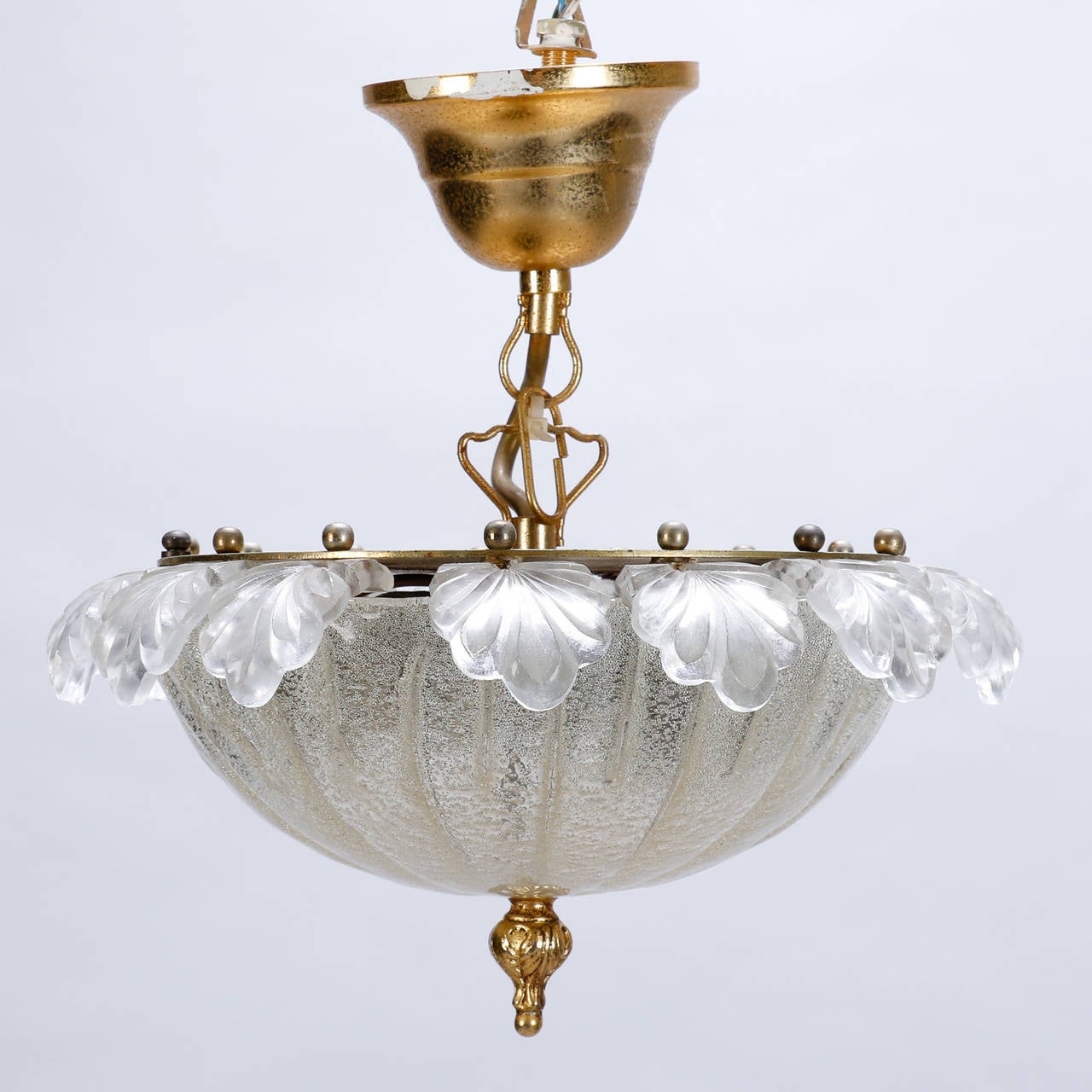 Pair circa 1960s Murano glass flush mount light fixtures have bowl shaped center with gold flecks and clear, leaf form border. Takes candelabra bulbs. New wiring for US electrical standards. Can be used on the ceiling or the wall. Sold and priced as