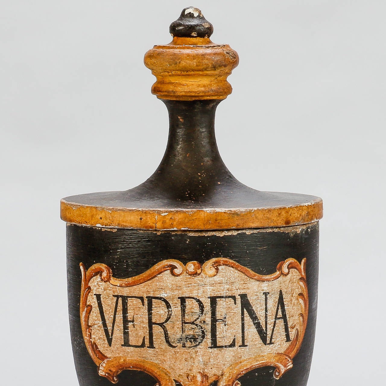 Tall lidded wood herb jar found in Italy, circa 1890s. Pedestal base, turned wood vessel with tall lid and original painted finish. Three jars currently available. The painted herb labels include: Melissa, Senna, Angelica & Betulla. Sold and priced