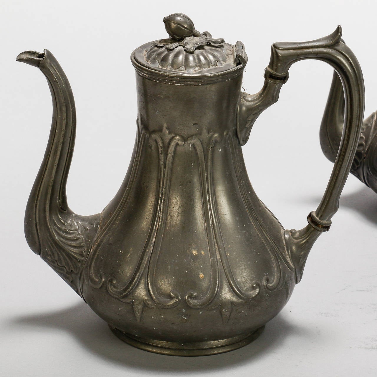 Circa 1940s four piece English pewter coffee / tea set includes coffee pot, tea pot, sugar and creamer. Stamped Grayson & Son, Sheffield. Measurements shown are for the tallest piece which is the coffee pot. Measurements for individual pieces listed