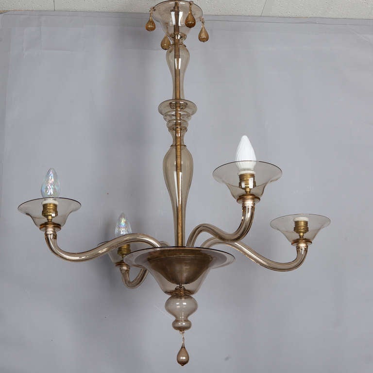 Four light Murano glass chandelier by Venini with slender arms and shaft. Glass ceiling canopy. New wiring for US electrical standards.
# of Sockets: 4
Socket Type: Regular.