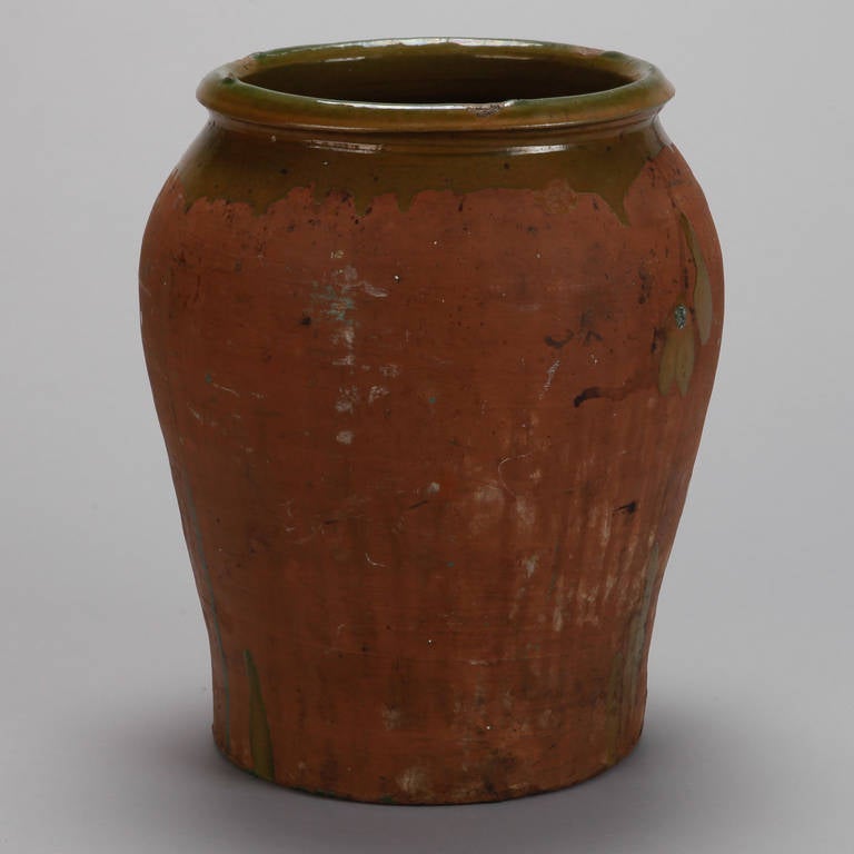 Classic rustic Spanish terra cotta pot with green drip glaze around the neck - one remaining. Sold and priced individually.
