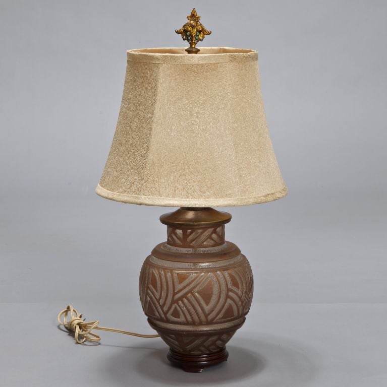 Circa 1920s Daum acid etched lamp base in shades of peachy brown. Bronze tone lamp hardware is marked USA and dated 1919. Double socket lamp, chain pulls and topped with a great old jeweled finial. Wired for US standards, cord hole is at side and