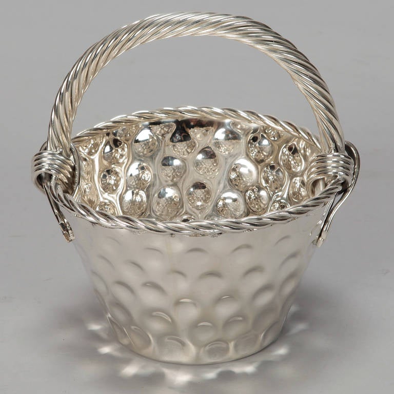 Circa 1960s Nickel Plated metal basket found in France. Bucket-form basket has a hammered surface, decorative twisted, rope-form border and thick, rope form handle.