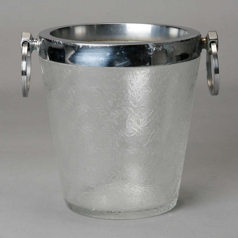 Circa 1930s ice bucket of clear crystal with an overall design topped with a silver plated rim and round handles.
