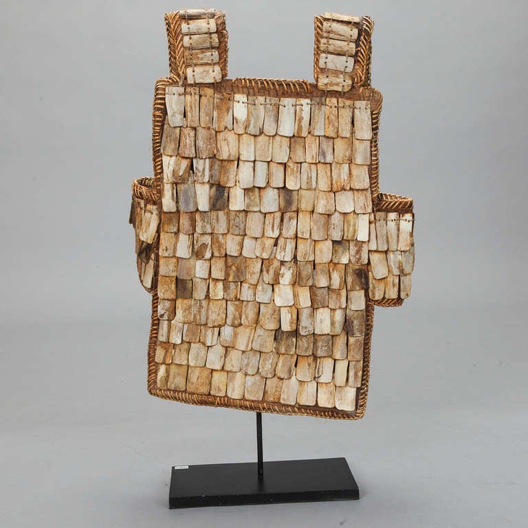 Chinese Woven Fiber Vest Decorated with Bone Beads On Stand