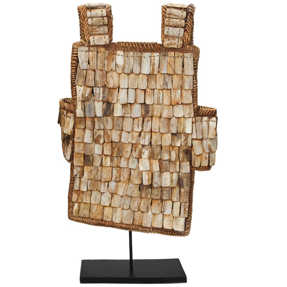 Chinese Woven Fiber Vest Decorated with Bone Beads On Stand