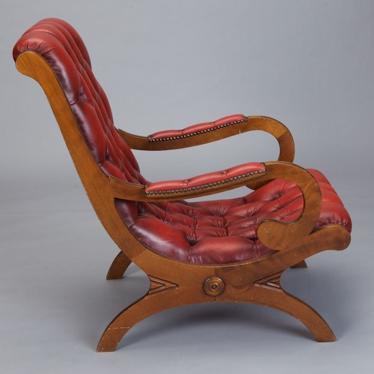 red leather chairs with ottomans