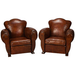 Pair of French Art Deco Leather Club Chairs with Camel Shaped Backs
