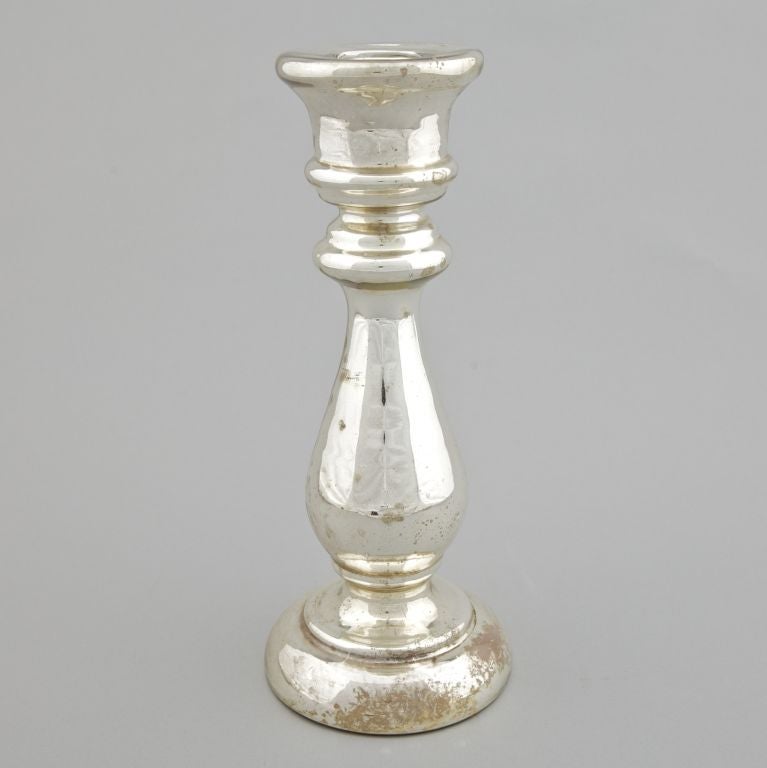 Large bulbous silver tone mercury glass candlestick. Two available in this size and shape. Sold and priced individually.