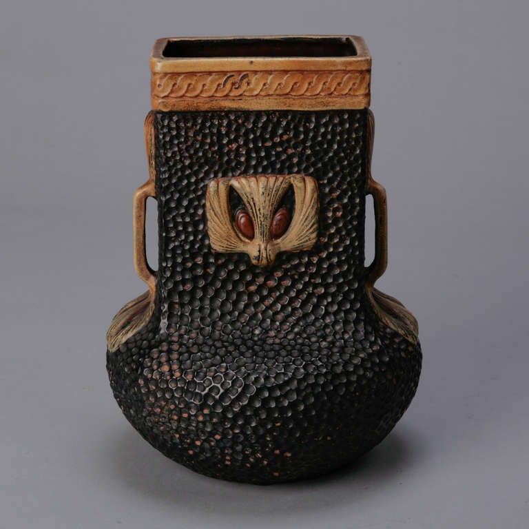 Large black Clanta Ware vase by Bretby of England with a stippled surface and classic Greek design elements.