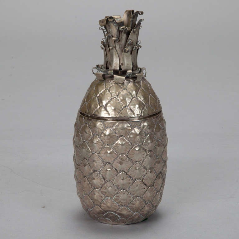 Circa 1940s brass ice bucket in the shape of a pineapple. Plastic liner.  We have additional pineapple form ice buckets - please inquire.