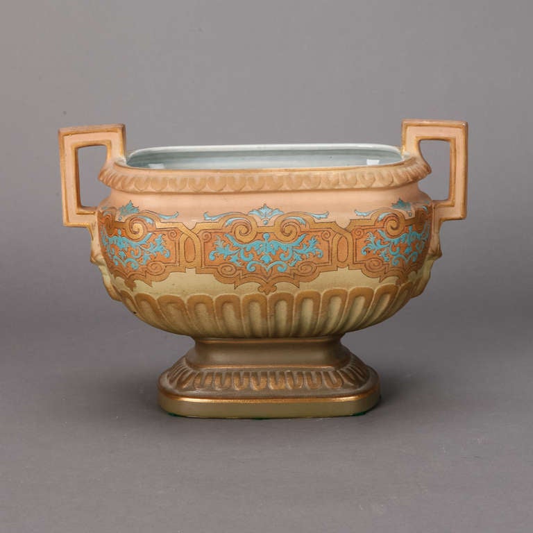 Circa 1940's centre bowl with art nouveau style and classical design elements in shades of apricot and blue.  Matching pair of mantle vases sold separately.