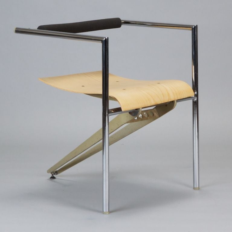 Armchair designed by Xavier Mategot for Via has a dramatic profile yet is very comfortable. Seat is 17.25