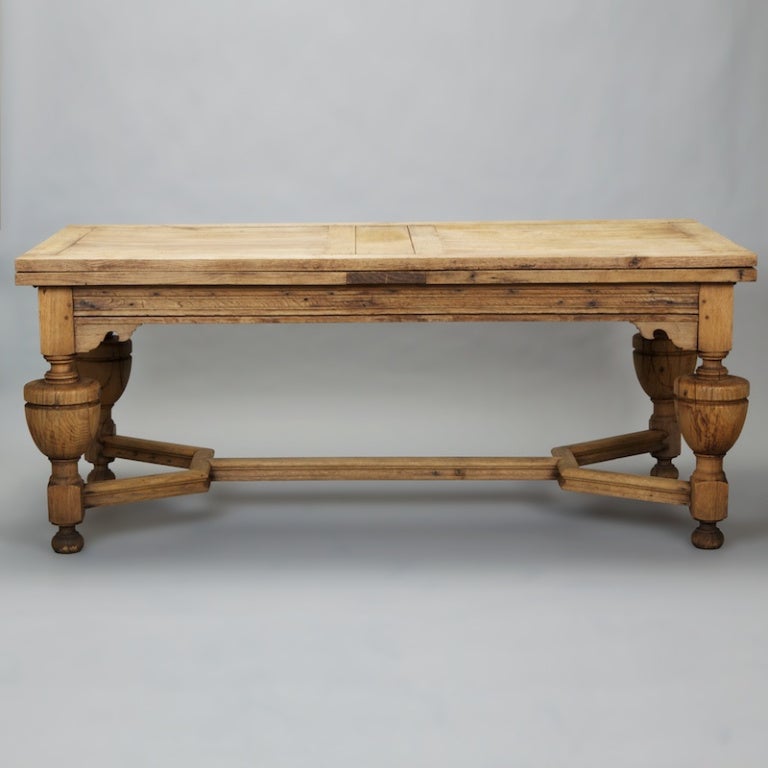Large circa 1890 French refractory table is made of bleached oak and has dramatic, spheroidal turned legs, stretcher, decorative apron and two 33-1/2