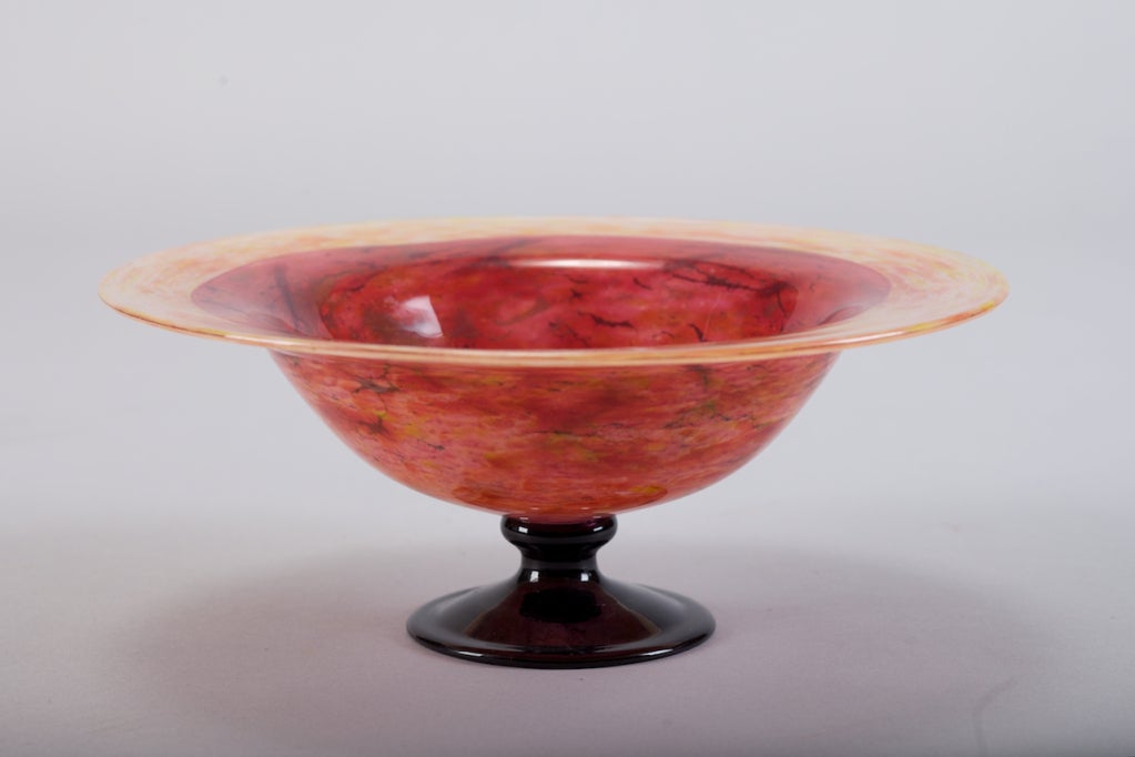 Gorgeous Schneider pedestal bowl has a deep amethyst base and the bowl is in sunset shades of orange and red with a lighter rim. Pedestal has etched Schneider signature and bottom of base is marked France.