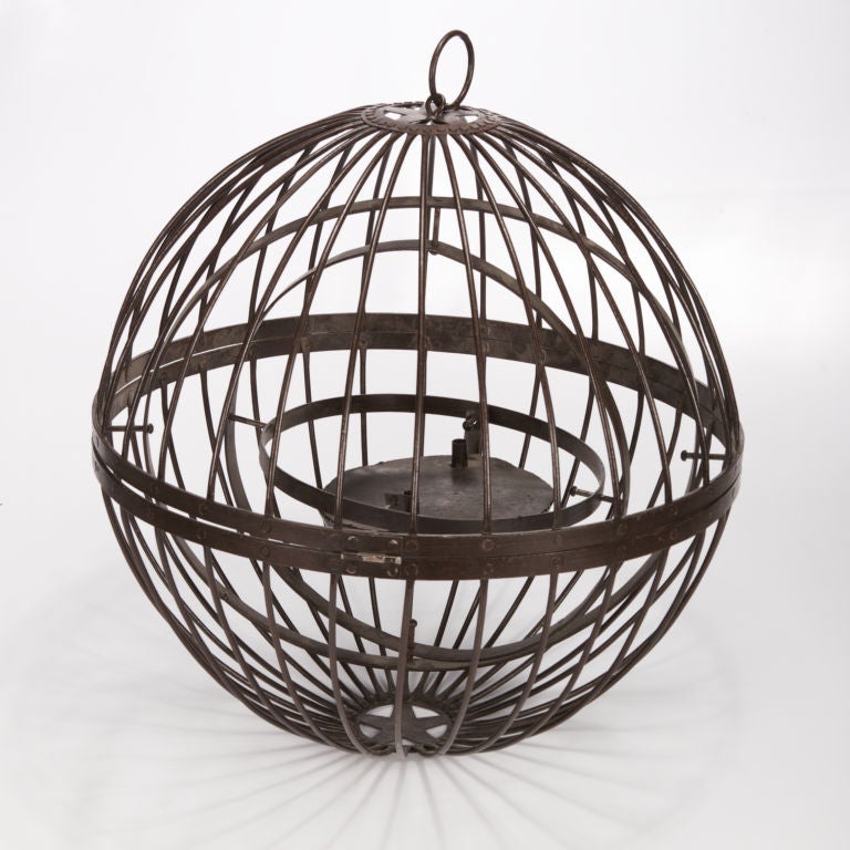 This over sized black metal globe oil lamp came from a ship, but makes a striking accessory for urban or rustic decor.