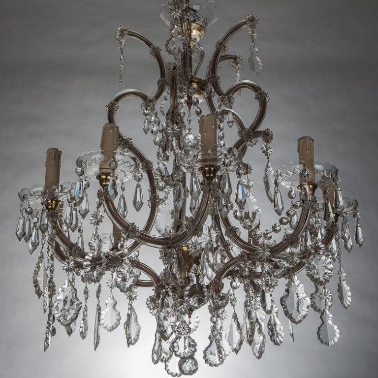 Circa 1900 classic eight light Maria Theresa chandelier has large faceted crystal drops and new wiring for US electrical standards.