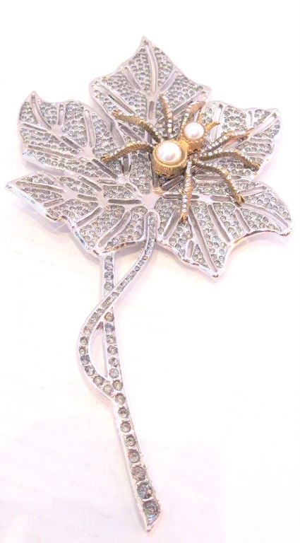 This gorgeous runway brooch piece by Valentino, features a sparkling leaf and an extremely glamorous spider.