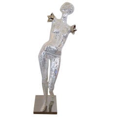 Sculpture de mannequin en mosaïque et miroir