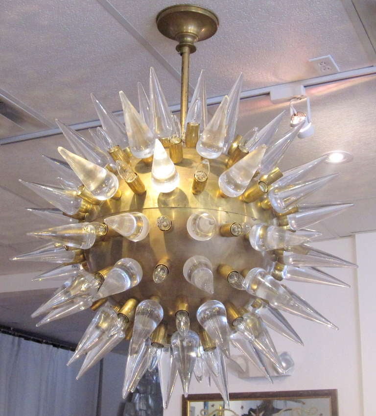 Exceptional gilt-metal spherical body with Murano glass cones and fitments for bulbs create a very astounding 