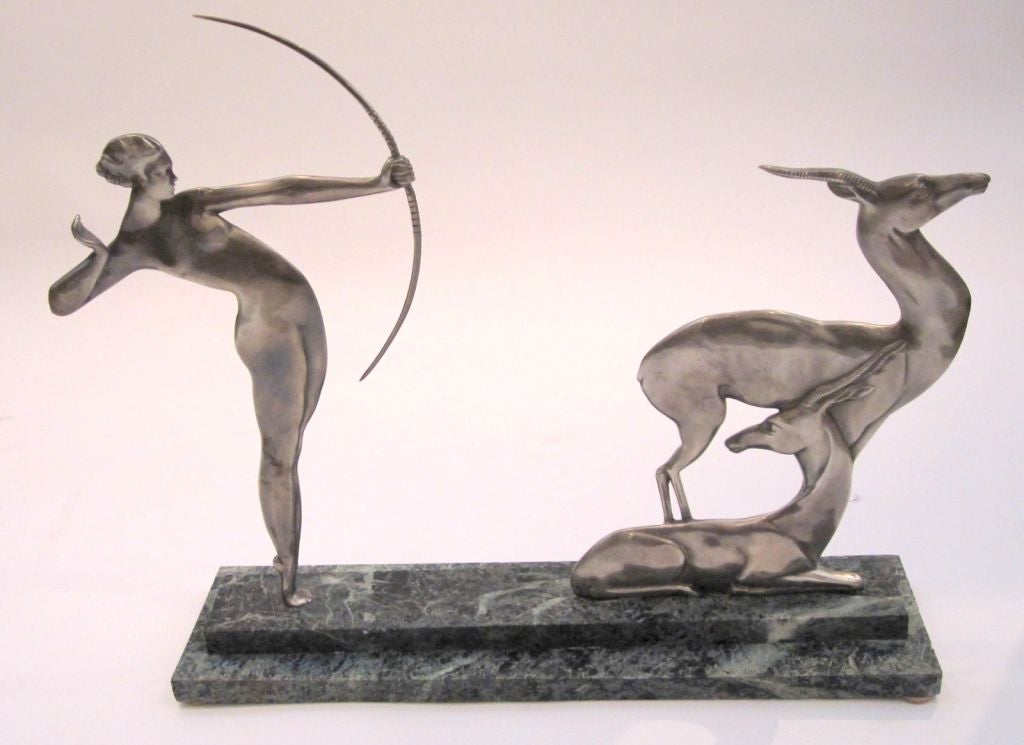 The huntress Diana is beautifully displayed in this gorgeous nickeled bronze on marble French Art Deco piece. Truely lovely from every angle, front, back, and sides.
