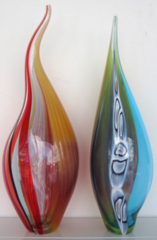 Special Flame Shaped Demonstration Pieces by Afro Celotto with Long Verticle Canes of Red, Amber Shades, Turquoise, and Olive.

Afro Celotto was born on August 24, 1963.He started working with glass when he was only 14 years old, apprenticing with