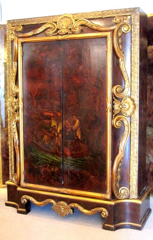 Extremely rare Jean Baptiste Pillement style, late 17th century-turn of the 18th century, Armoire on base. Chinoiserie decor on the doors and sides.Early Rococo carved wood with gold leaf ornates and frames this spectacular beauty.