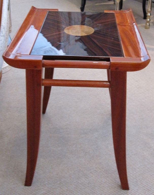 Beautiful Tapered Legs, Curved Table Top, the Combination of Woods, Macassar and Rosewood, along with the Centered Egg Shell Medallion make this French Art Deco Occasional Table a Real Jewel!