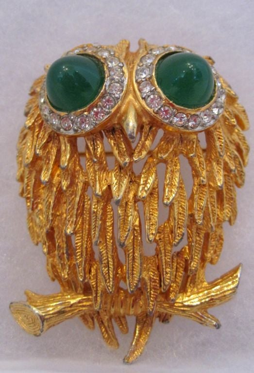 A Gorgeous Vintage Kenneth Jay Lane Owl Brooch with Simulated Emerald Eyes Surrounded by Clear Rhinestones.