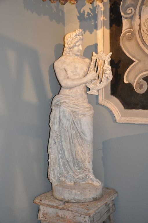 A FRENCH RECONSTITUTED STONE STATUE OF ORPHEUS
