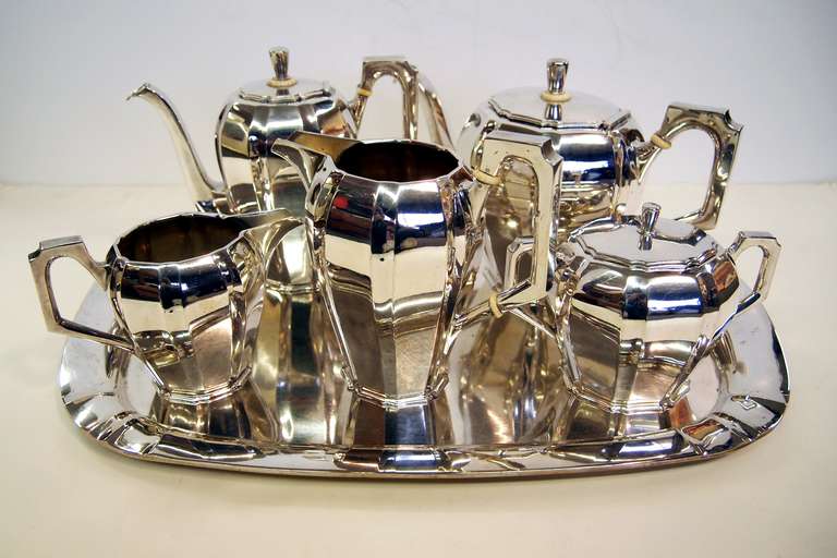 This is a stylish Art Deco Tea and Coffee set from Austria in .800 silver. It comprises of a Teapot, Coffee Pot, Hot Water Jug, Cream Jug, Sugar Bowl and matching Tray.   This substantial set was given as a wedding present in Vienna in 1934.It has