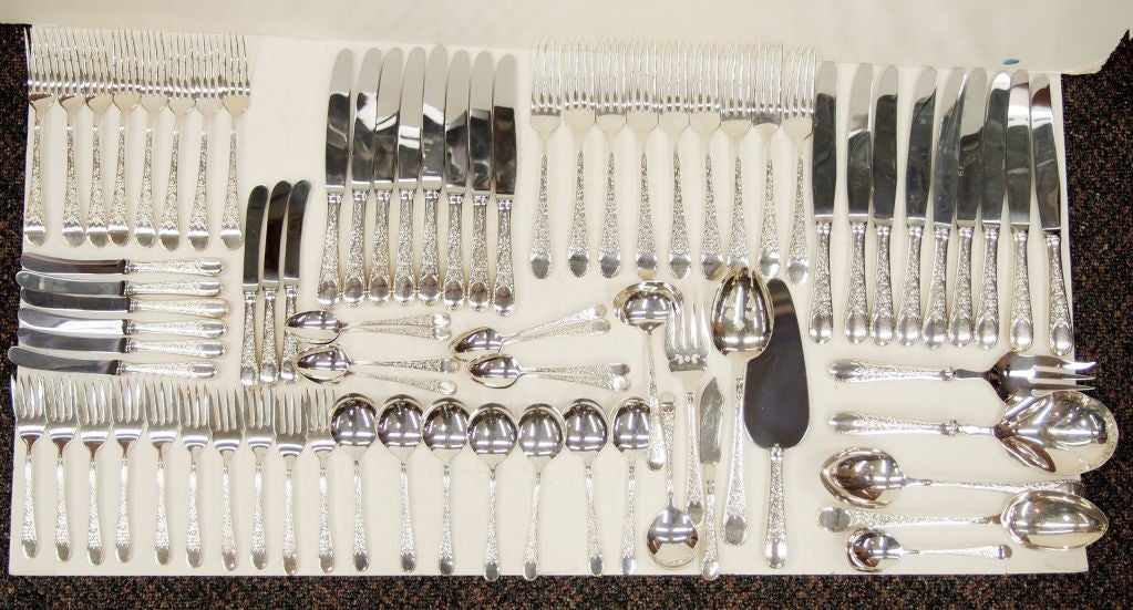 A Sterling Silver Flatware in the popular London Engraved pattern setting for Eight plus extra pieces for a total of 79 pieces. Set has 9 dinner knives, 9 dinner forks, 8 luncheon knives, 8 luncheon forks, 9 butter knives, l0 pie forks, 8 soup