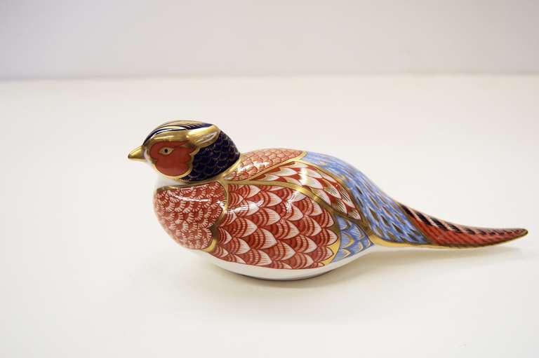 From the famous Royal Crown Derby Porcelain Factory in England comes this Pheasant Paperweight.  One of many birds and animals they have produced in this series.  This one dates to the 1980s.  There4 is a gold plug in the base which is removed and