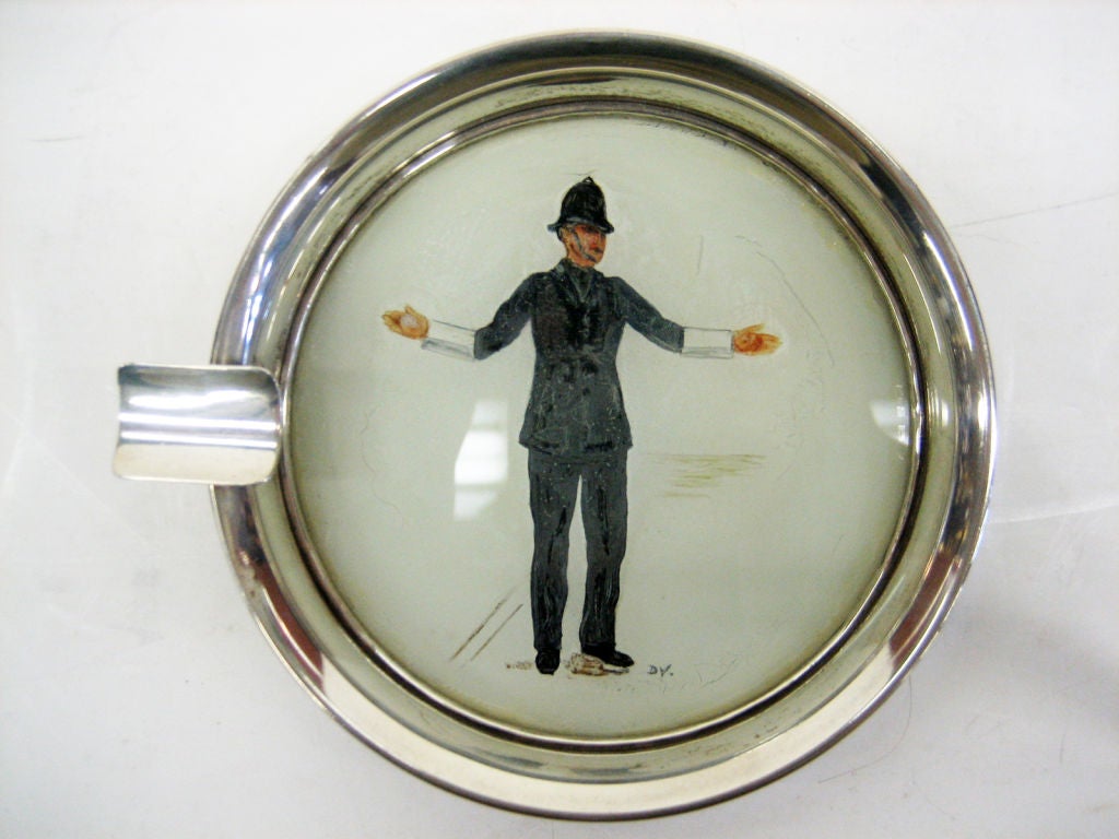 A Sterling Silver & Enamel Ashtray with the figure of a Bobby driecting traffic.