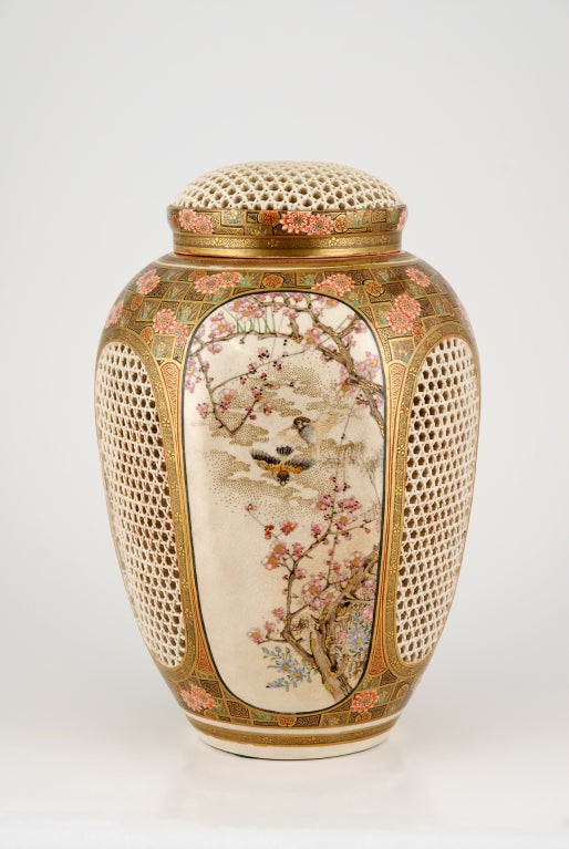 A fabulous hand painted, antique Satsuma Pot-Pourri covered jar by the master Meiji painter Ryozan.  This sixth sided jar has three magnificently painted scenes interspersed with three pierced panels.  The rest of the body has decoration of painted