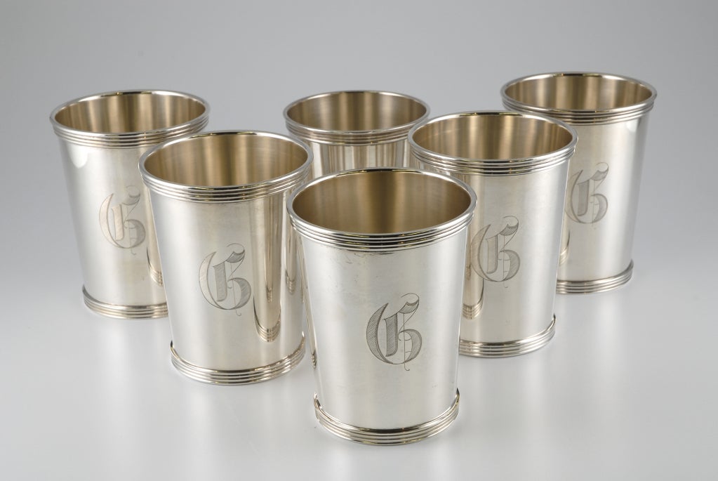 Six Sterling Silver Mint Julep Cups all monogrammed.  Five are identical and made by International Sterling and the sixth by another U.S. maker.  Weight:  725 grams