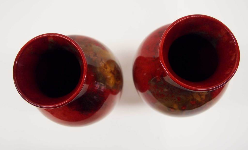 An impressive and colourful pair of Porcelain Vases with a Flambe glaze from Royal Doulton, England.  The mark on the base shows FM (flambe mark) and the 1920-40 backstamp.